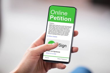 Man Looking At Online Petition Form On Smartphone clipart