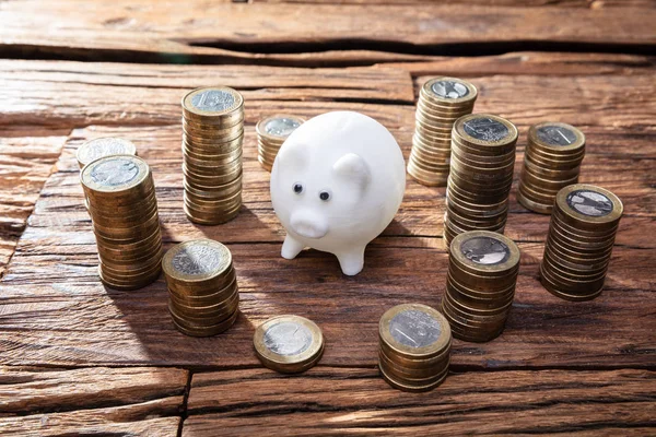 Close Pink Piggy Bank Stacked Coins Wooden Desk — Stock Photo, Image