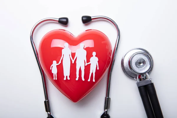 High Angle View Family Cut Out Red Heart Shape Stethoscope — стоковое фото