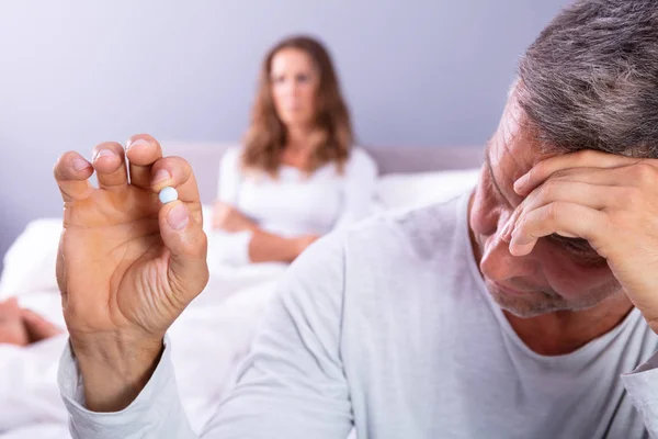 Matured Man Suffering Erectile Dysfunction Holding Pill Hand His Wife — Stok Foto