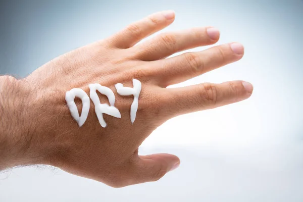 Dry Text Drawn Lotion Person Hand White Background — Stock Photo, Image
