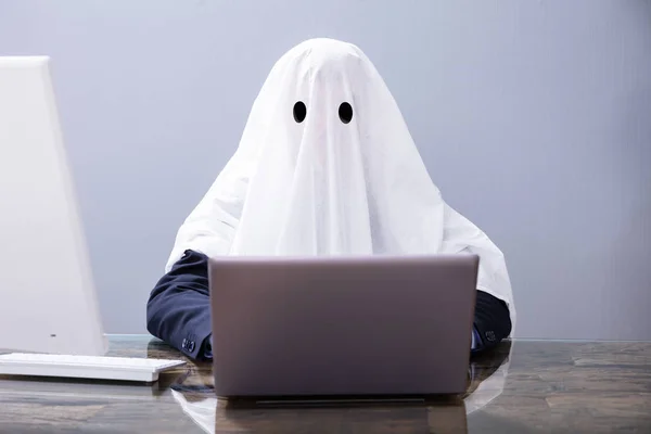 Ghostwriter Writing Article On Laptop In Office