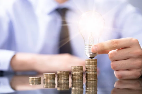 Man Got Idea How Grow Profits Holding Lughtbulb — Stock Photo, Image