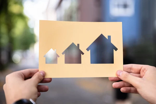 Hands Holding Paper Cutout House Growth Outdoors — Stock Photo, Image