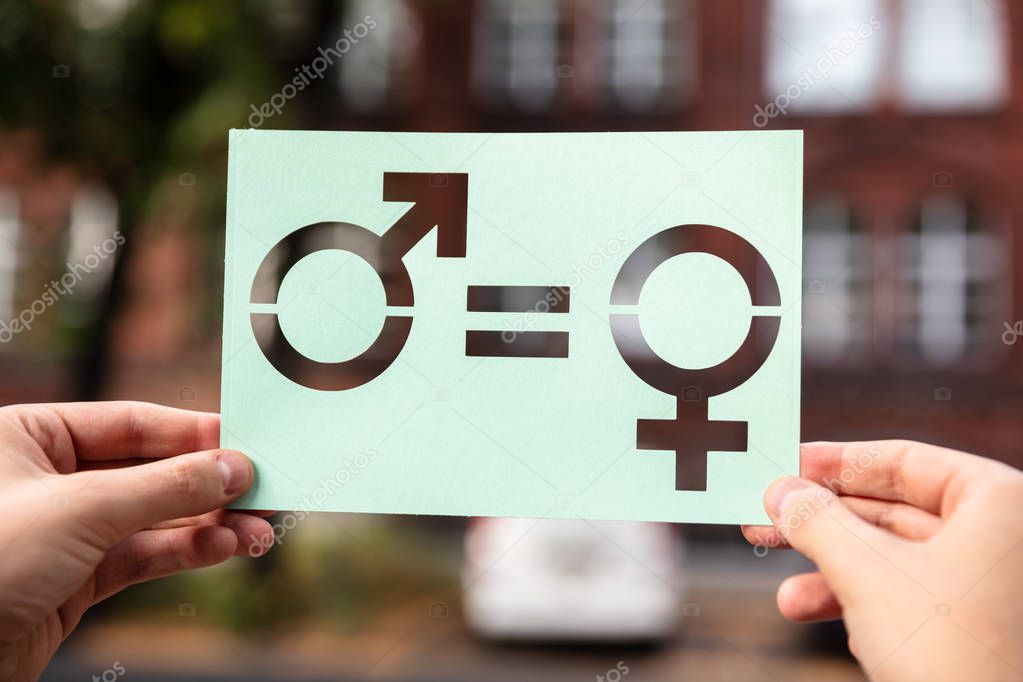 Hands Holding Paper With Cutout Gender Equality Outdoors