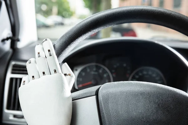 Close Robotic Hands Car Steering Wheel — Stock Photo, Image