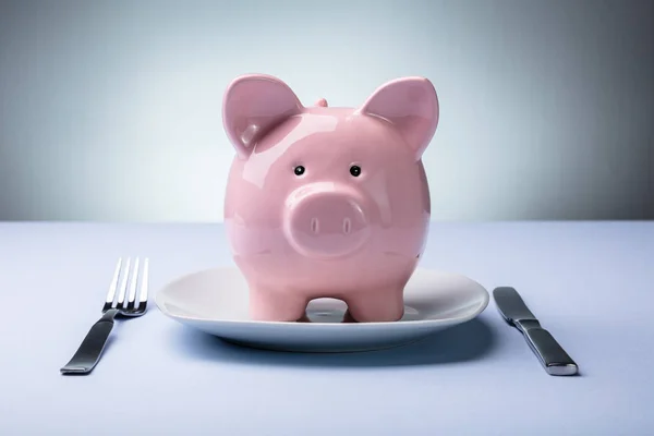 Elevated View Pink Piggy Bank White Plate Fork Knife — Stock Photo, Image
