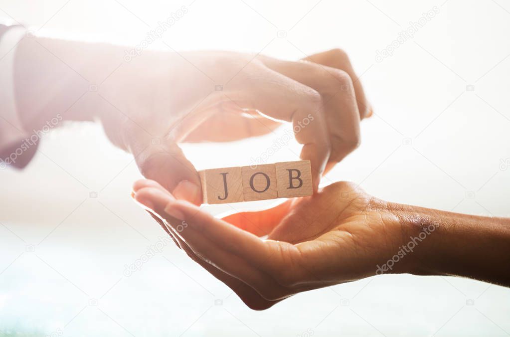 Businessperson Giving Wooden Block With Job Text To Candidate