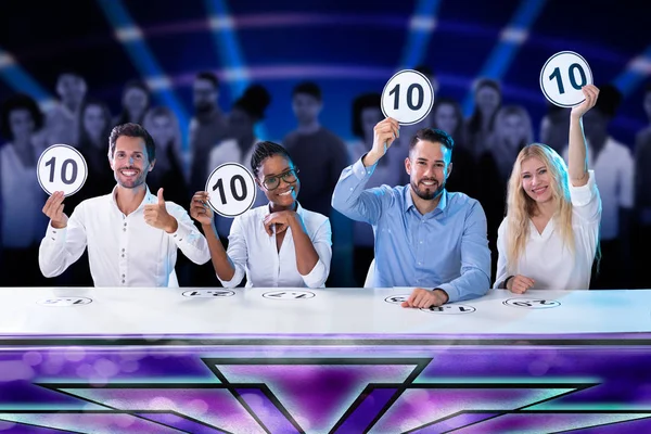 Happy Panel Judges Sitting Front Red Curtain Showing Score Signs — Stock Photo, Image