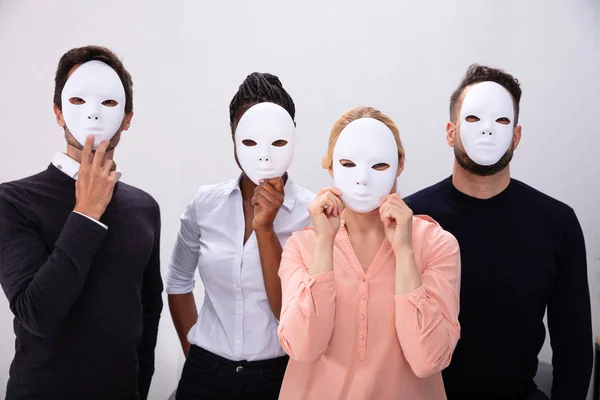 Group People Standing Together Covering His Face White Masks — Stockfoto