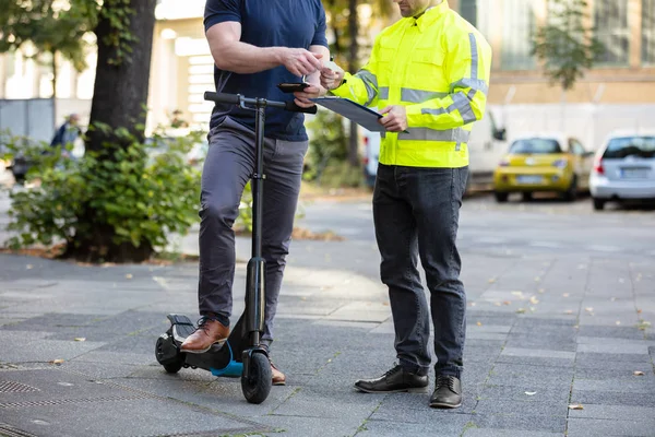 Mid Section Man Electric Scooter Showing Drivers License Traffic Officer — Stock Photo, Image