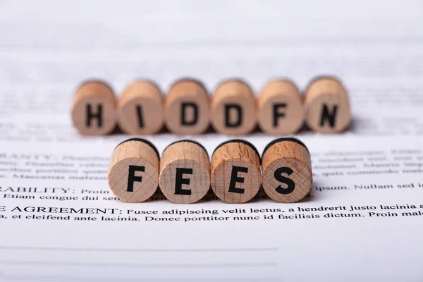 Wooden Letters Forming Hidden Fees Words Contract Papers — Stock Photo, Image