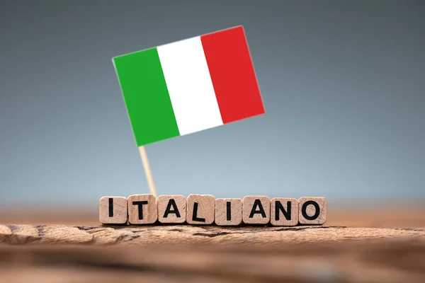 Italian Word Formed Using Wooden Block Flag Desk — Stock Photo, Image