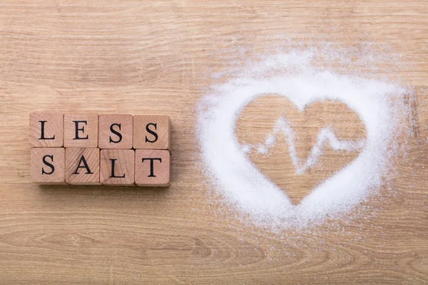 Less Salt Heart Shape Heartbeat Wooden Desk — Stock Photo, Image