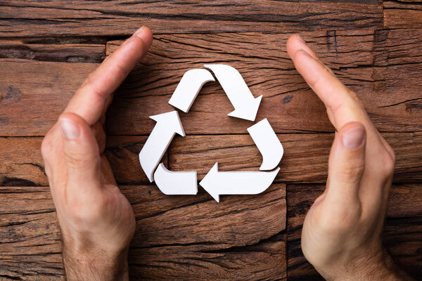 Hands Protecting Recycling Icon In Environmental Protection Concept