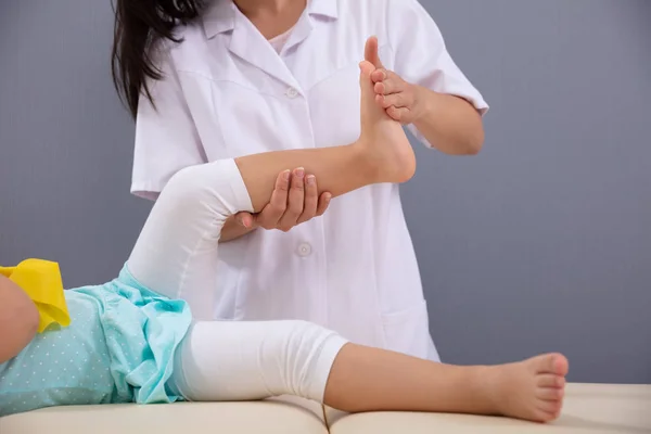 Close Female Physiotherapist Massaging Patient Girl Foot — Stock Photo, Image