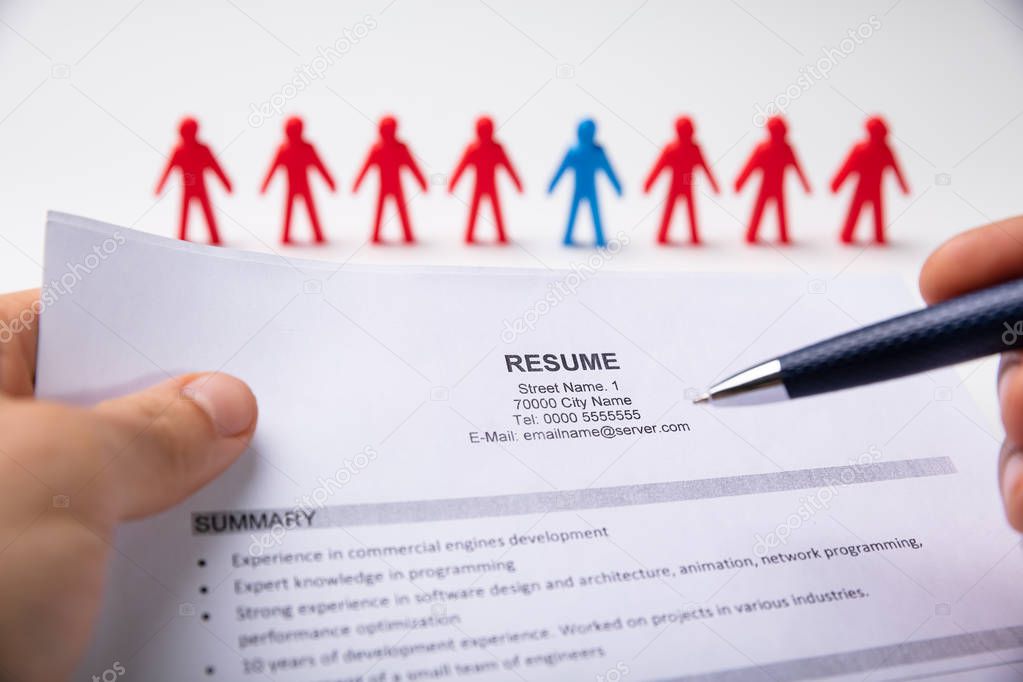 HR Manager Reading Resume Of Ideal Job Candidate