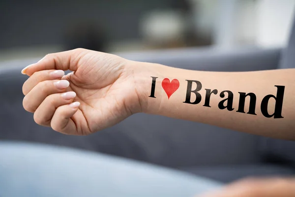 Woman Showing Her Love Brand Tattoo — Stock Photo, Image
