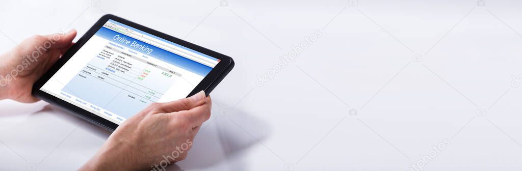 Person Using Online Banking On Tablet Computer