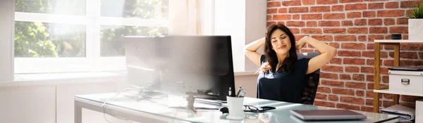 Desk Stretch Exercise. Woman Stretching At Work In Office