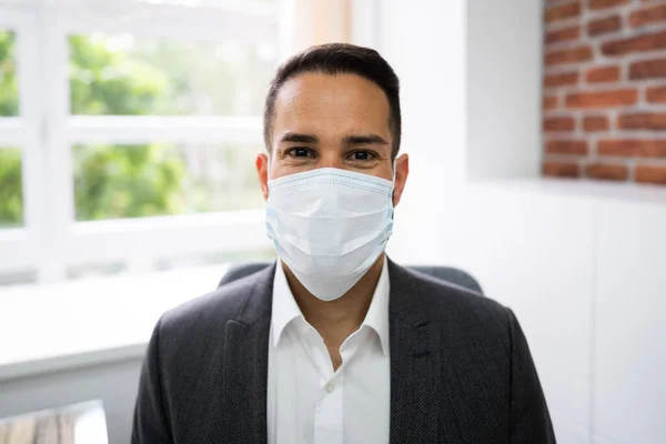 Male Receptionist In Medical Doctor Face Mask