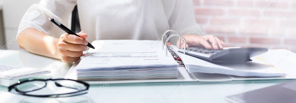 Accountant Woman Calculating Corporate Tax And Expenses Using  Calculator