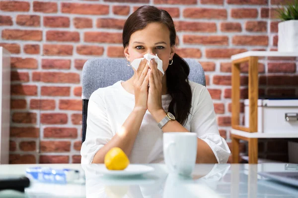 Sick Business Employee Or Worker Sneezing In Office