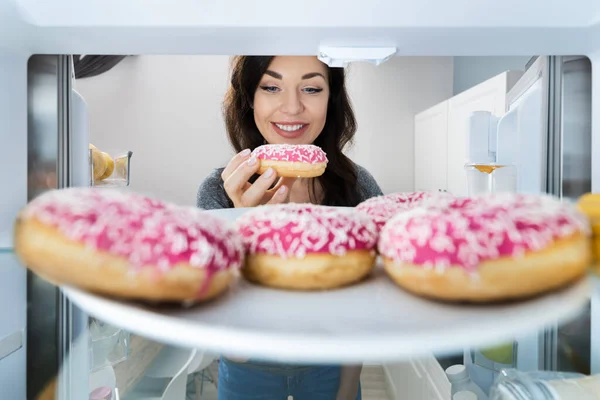 Happy Young Woman Taking Donut Refrigerator Freezer — Stock Photo, Image