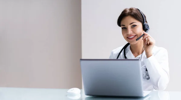 Happy Doctor Wearing Headset In Call Center