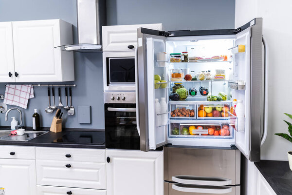 Open Refrigerator Or Fridge Door With Food Inside