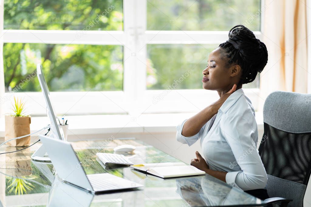 Woman With Bad Posture And Ergonomics While Sitting