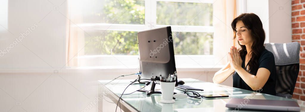 Employee Woman Praying Near Computer At Office 