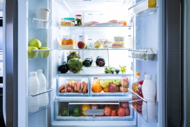 Open Refrigerator Or Fridge Door With Food Inside clipart
