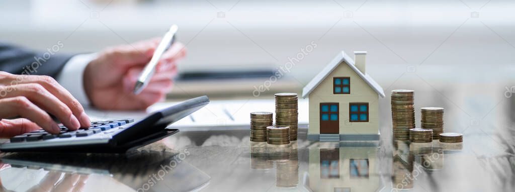 Estate Real House Price And Insurance On Desk