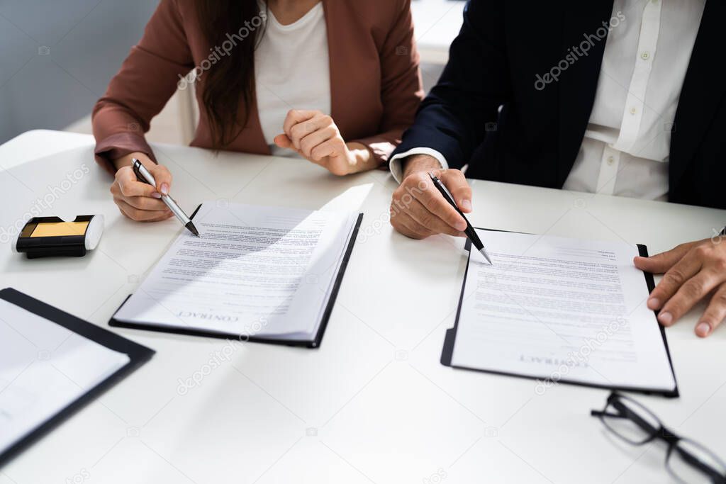 Lawyer People Review Document Before Signing In Office