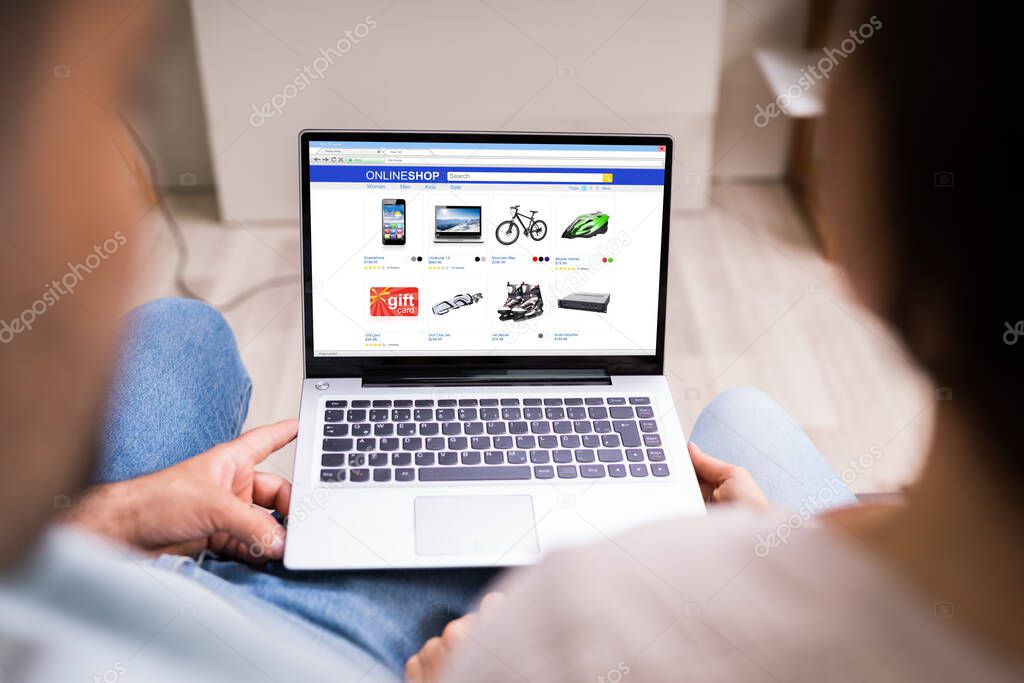 Couple Shopping Electronics Online In Ecommerce Shop