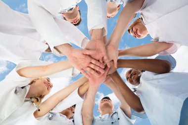 Diverse Medical Team Staff Hands Stack Outdoors clipart