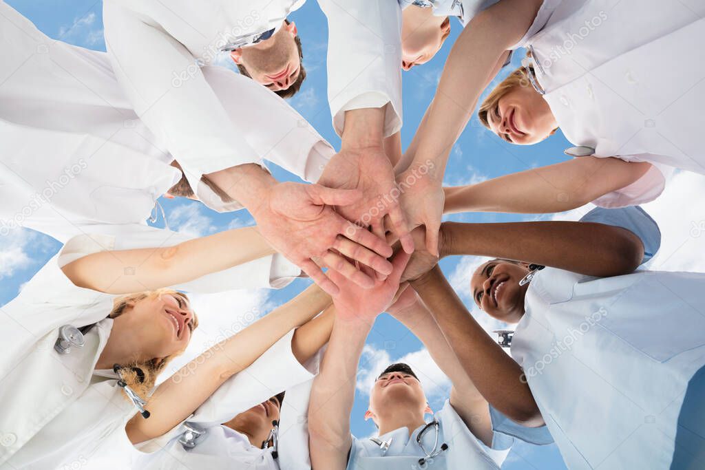 Diverse Medical Team Staff Hands Stack Outdoors