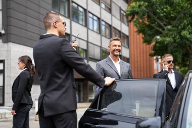 Bodyguards Protecting Businessman Opening Car Vehicle Door clipart