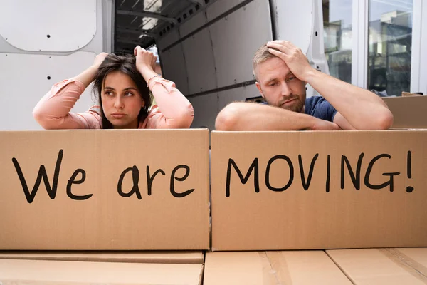 Home Move Stress. Frustrated Couple Moving Apartment