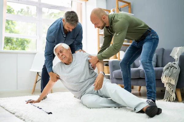 Helping Elder Senior Fallen Man Fall Accident — Stock Photo, Image