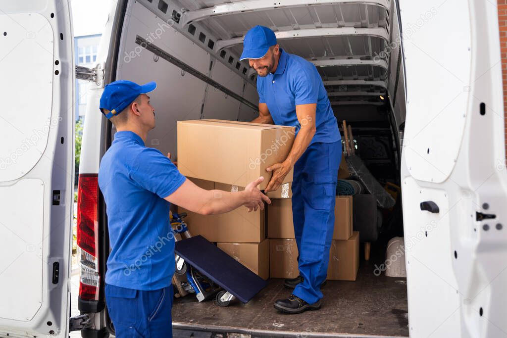 Home Moving Services. Movers Loading Van Or Truck