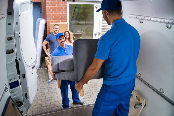 Happy Family Couple Watching Movers Unload Furniture Truck — Stock Photo, Image