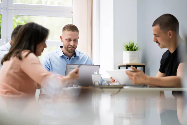 Meeting Business At Conference Table. Diverse Professional Persons