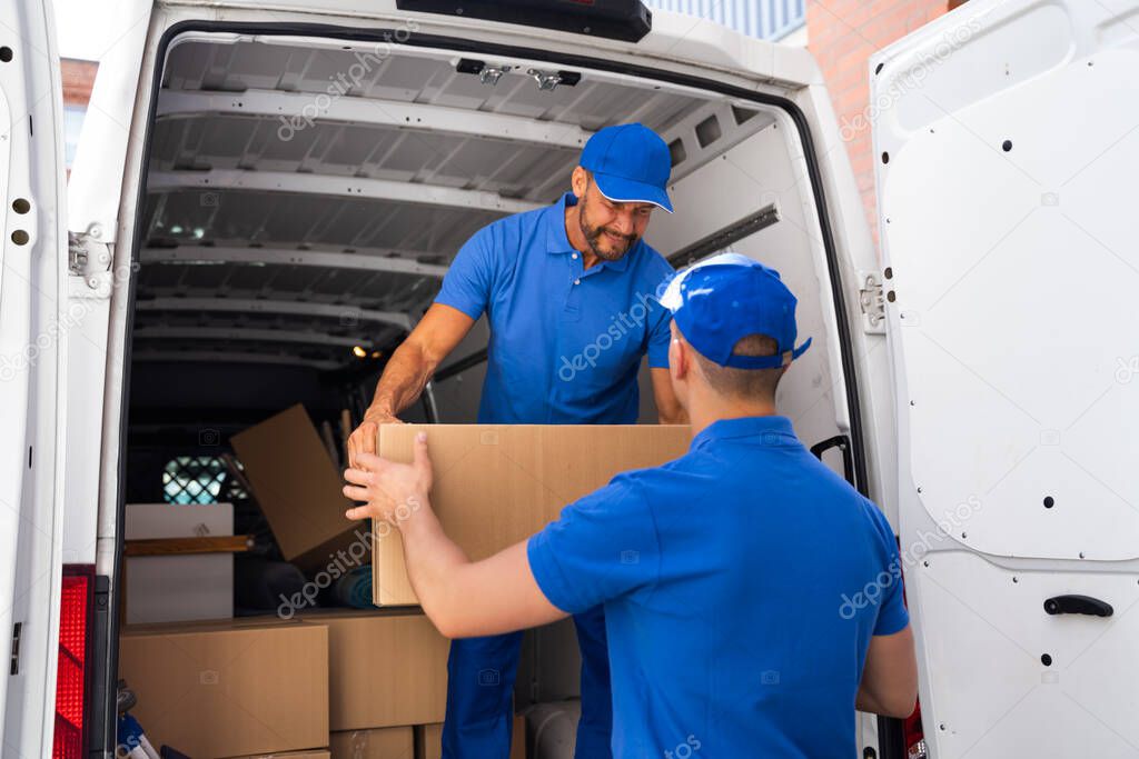 Home Moving Services. Movers Loading Van Or Truck