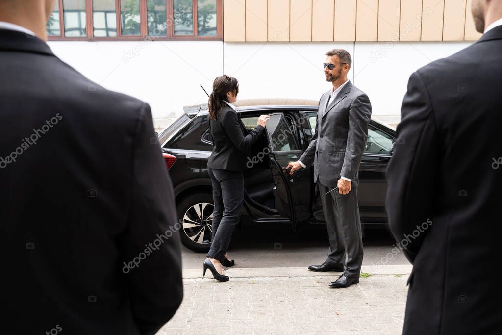 Bodyguards Protecting Businesswoman Opening Car Vehicle Door