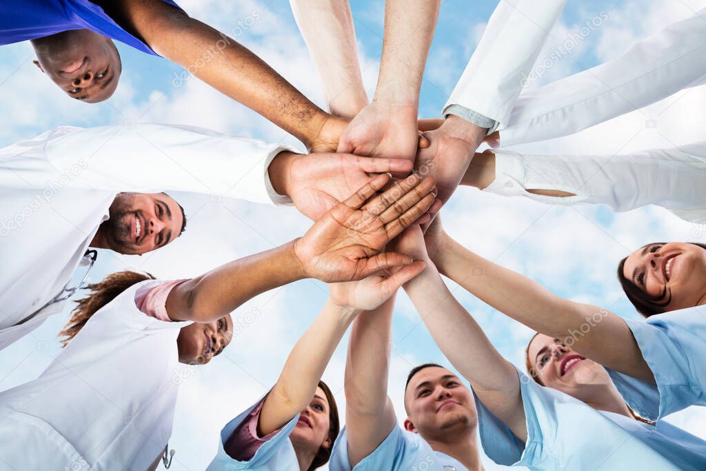 Diverse Medical Team Staff Hands Stack Outdoors