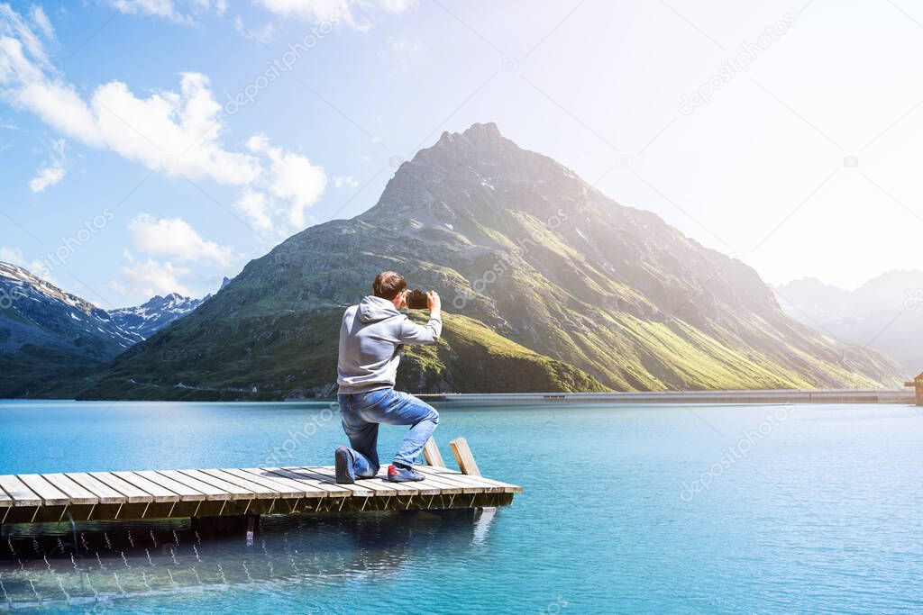 Photographer Man Taking Mountain Lake Photo With Camera