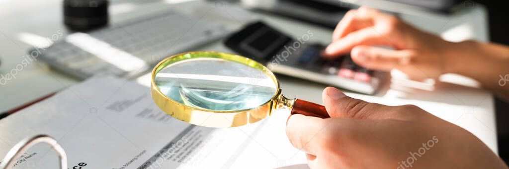 Fraud Investigation Using Magnifying Glass. Business Tax Audit