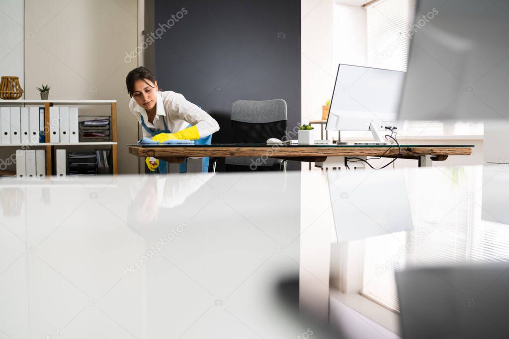 Janitor Cleaning Office Desk. Hygiene Cleaner Service